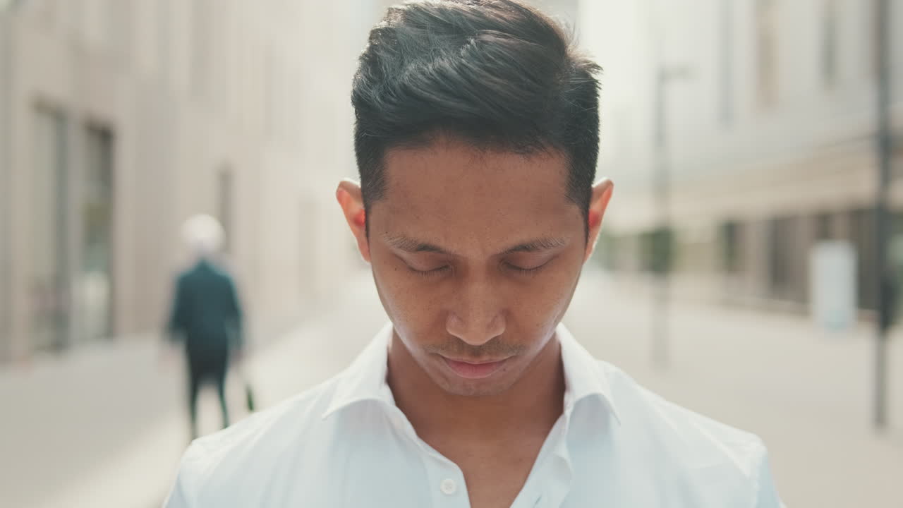 Portrait of a man on a city street