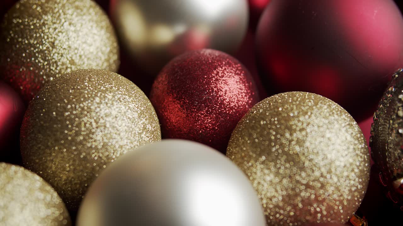 beautiful red and gold baubles on a Christmas background