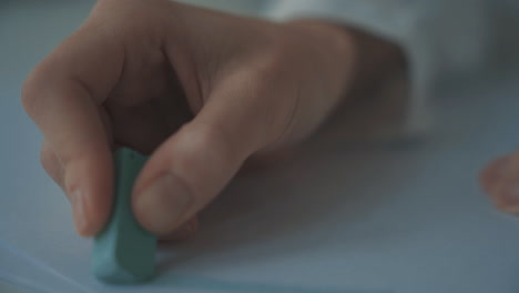 Close-Up-Of-Child-Hands-Drawing-Straight-Lines-And-Triangles