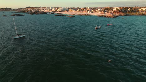 Aerial-panoramic-view-of-Bahia-Inglesa-Beach-with-boats-moored-in-the-distance,-Coquimbo,-Chile