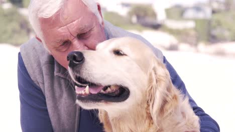 old retired man embracing his dog