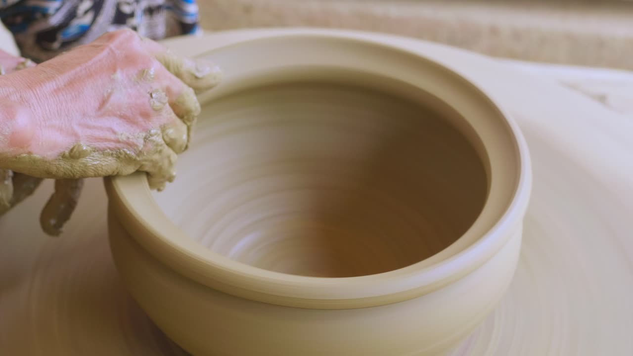 Therapeutic fine touches to sculpt ceramic pot on potter wheel