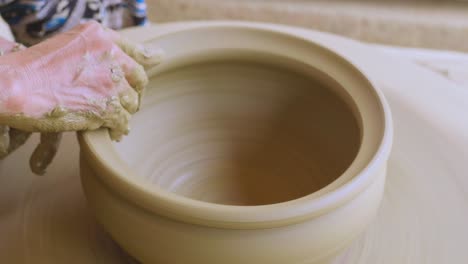 therapeutic fine touches to sculpt ceramic pot on potter wheel