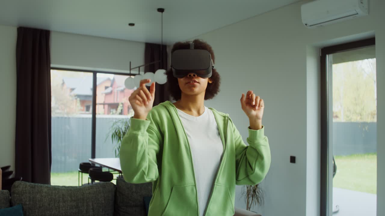 Woman uses a VR headset in her living room