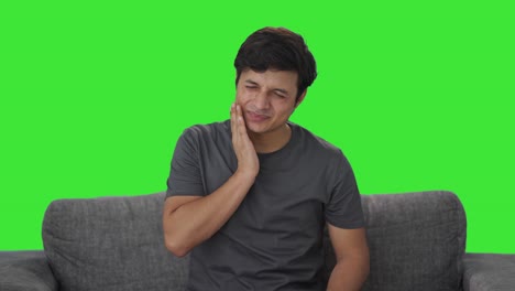 Sick-Indian-man-suffering-from-tooth-pain-Green-screen