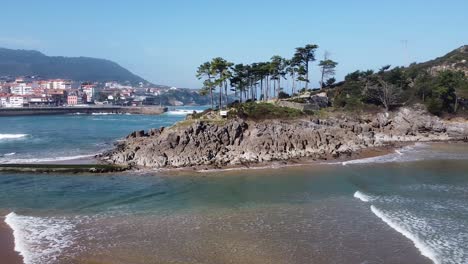 drone aerial view of the san nicolás island at the beach of lekeitio in the basque country