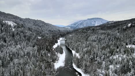 majestic mountains and winter wonderland: a drone's eye view of the adams river in british columbia