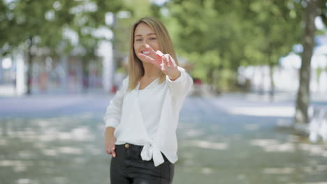 beautiful happy young woman posing and gesturing outdoor