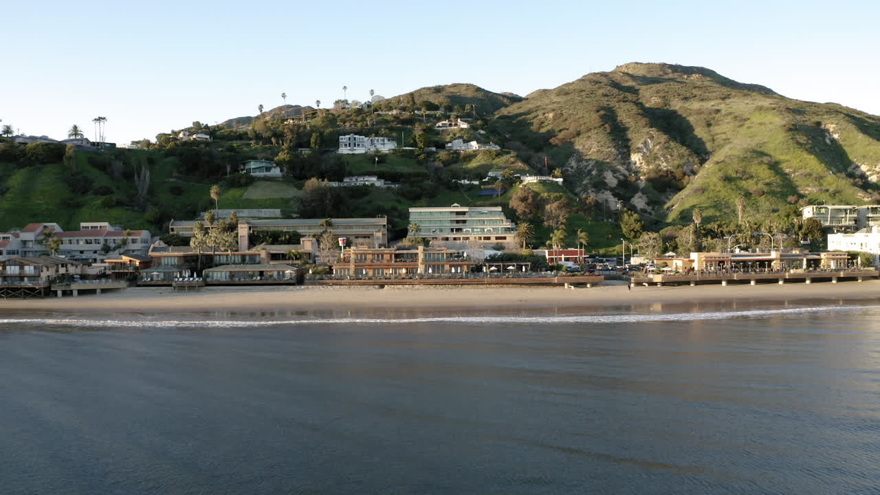 Malibu Beach with Coastal Buildings and Green Hills