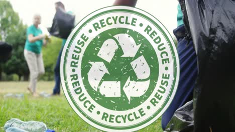 animation of recycling icon over volunteers cleaning in park