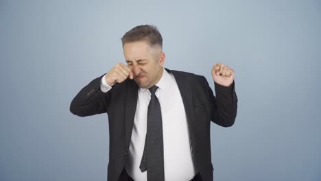 businessman smelling sweat expressing negative at camera.