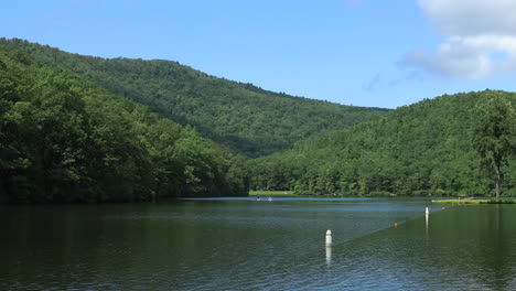 A-blue-sky-summer-day-at-Sherando-Lake,-part-of-the-George-Washington-National-Forest,-in-Virginia's-Blue-Ridge-Mountains