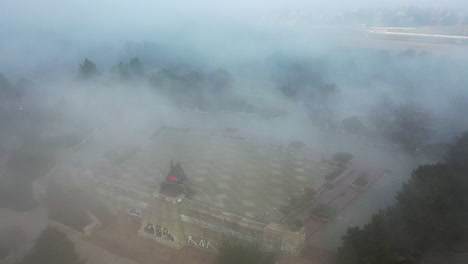 Aerial-View-of-Metronome-Monument-and-Stalin-Plaza-in-Dense-Fog,-Prague,-Czech-Republic