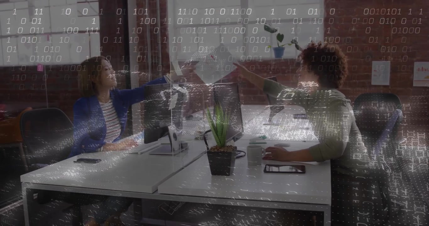 Woman picking printed sheet and passing to man for office review before resuming typing