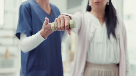 Woman,-patient-and-physiotherapy-with-dumbbell