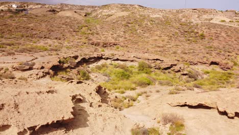 Geological-rock-formation-in-hot-sandy-desert-area-of-Tenerife-island,-aerial