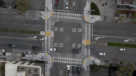 From-a-bird's-eye-view-on-a-serene,-Saturday-morning-after-the-rain,-this-still-drone-shot-provides-an-uncommon-perspective-of-the-crossing-at-University-and-Sacramento-Street-in-Berkeley,-CA