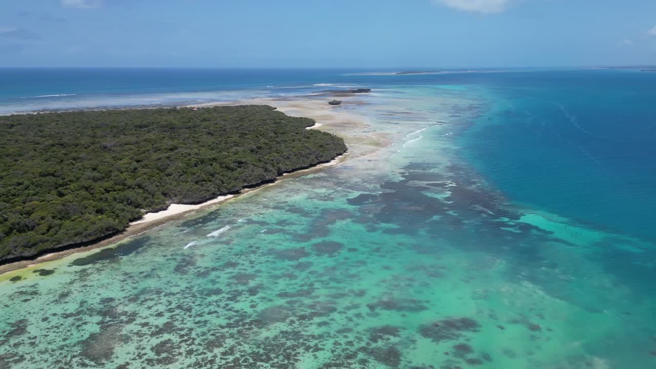 Coral reef barrier in Pungume Island south Zanzibar Tanzania Africa, Aerial pan right shot