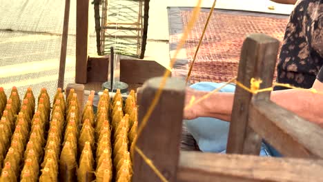 artisan weaving silk in khao yai, thailand