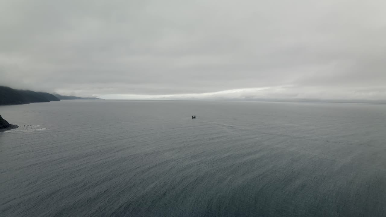 Fishing Boat Floating On The Calm Sea On A Foggy Day In Quebec, Canada