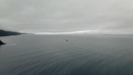 Fishing-Boat-Floating-On-The-Calm-Sea-On-A-Foggy-Day-In-Quebec,-Canada