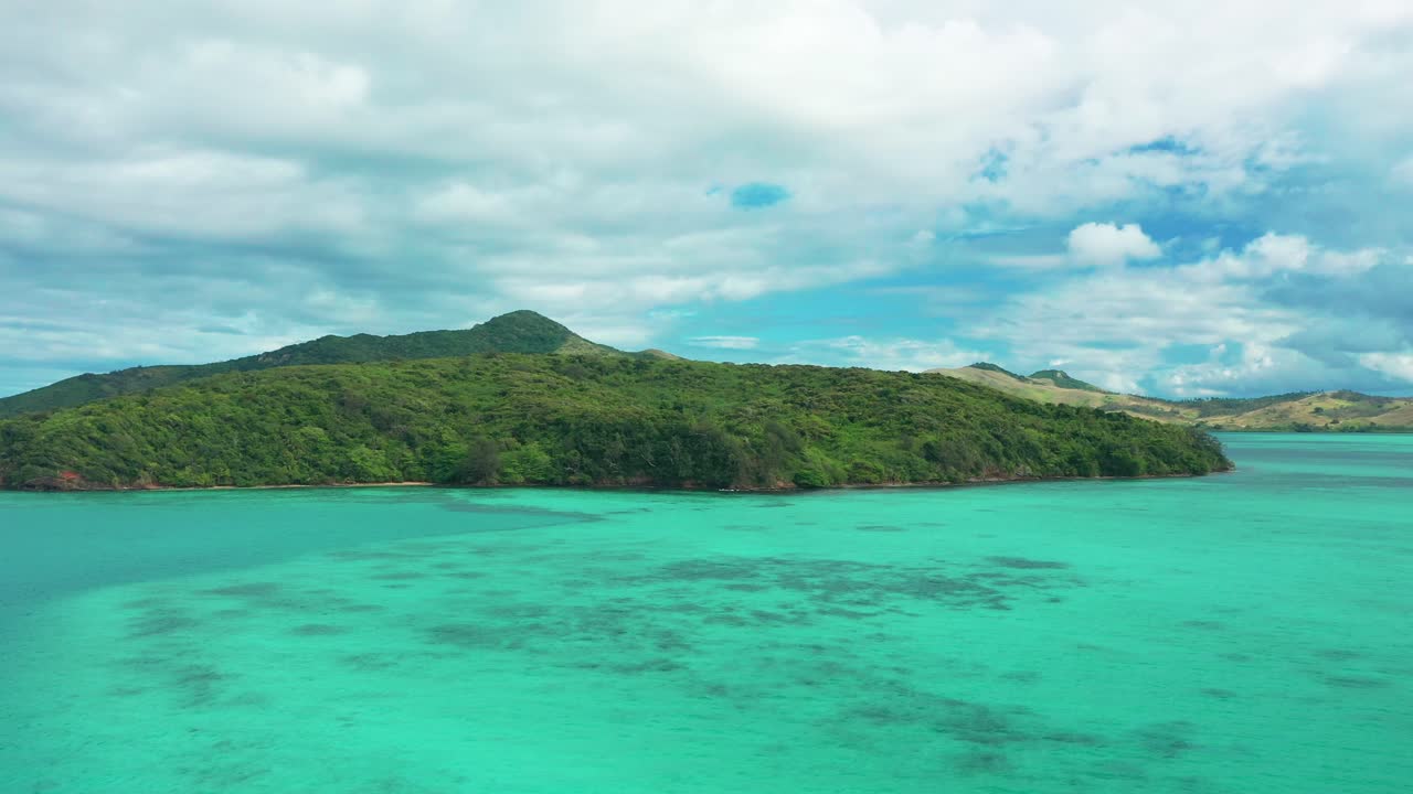 The pristine blue waters by the Fiji islands - aerial