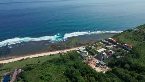 Uluwatu-Nyang-Nyang-Beach-with-airplane-hotel-at-the-cliff-in-Bali,-Indonesia