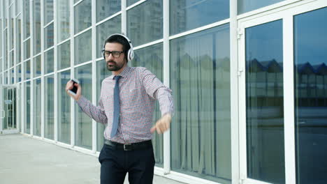 businessman dancing in the city