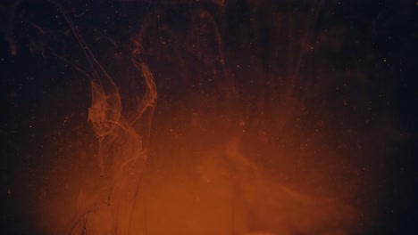 nube naranja de pintura bajo el agua, tinta azul inyectada desde el lado derecho, fondo negro, cámara lenta