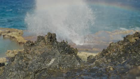 small rainbow showing at blow hole in tinian island