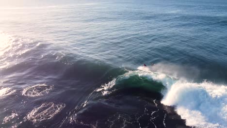 drone aerial videography of surfer riding barrel wave with spit on reef pacific ocean central coast nsw australia 3840x2160 4k