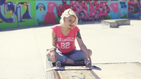 young woman sitting in the hot sun waiting