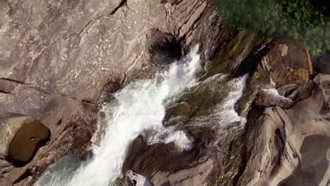 Top-shot-of-a-small-river-with-rapids-and-pools-in-northern-Norway