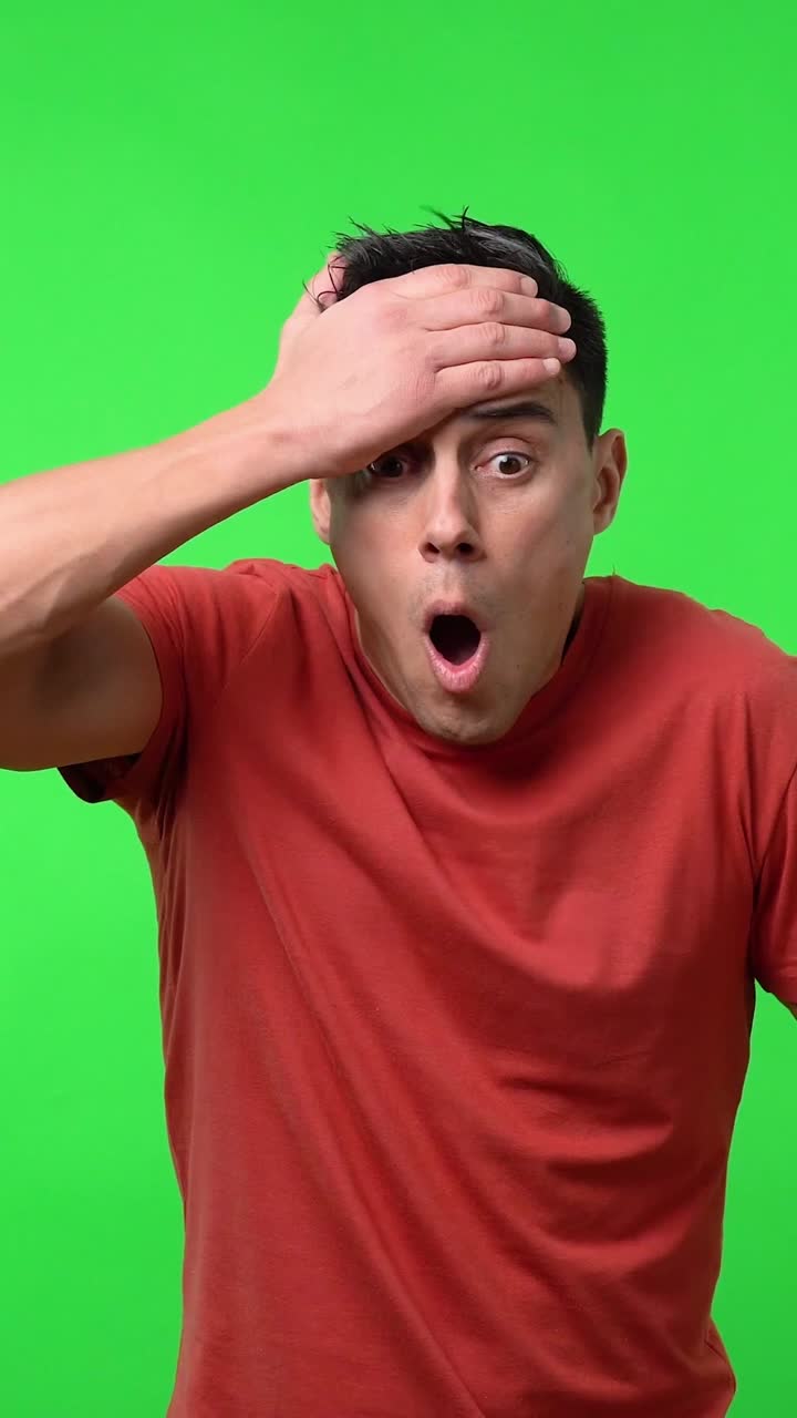Man expressing negative emotions on green screen