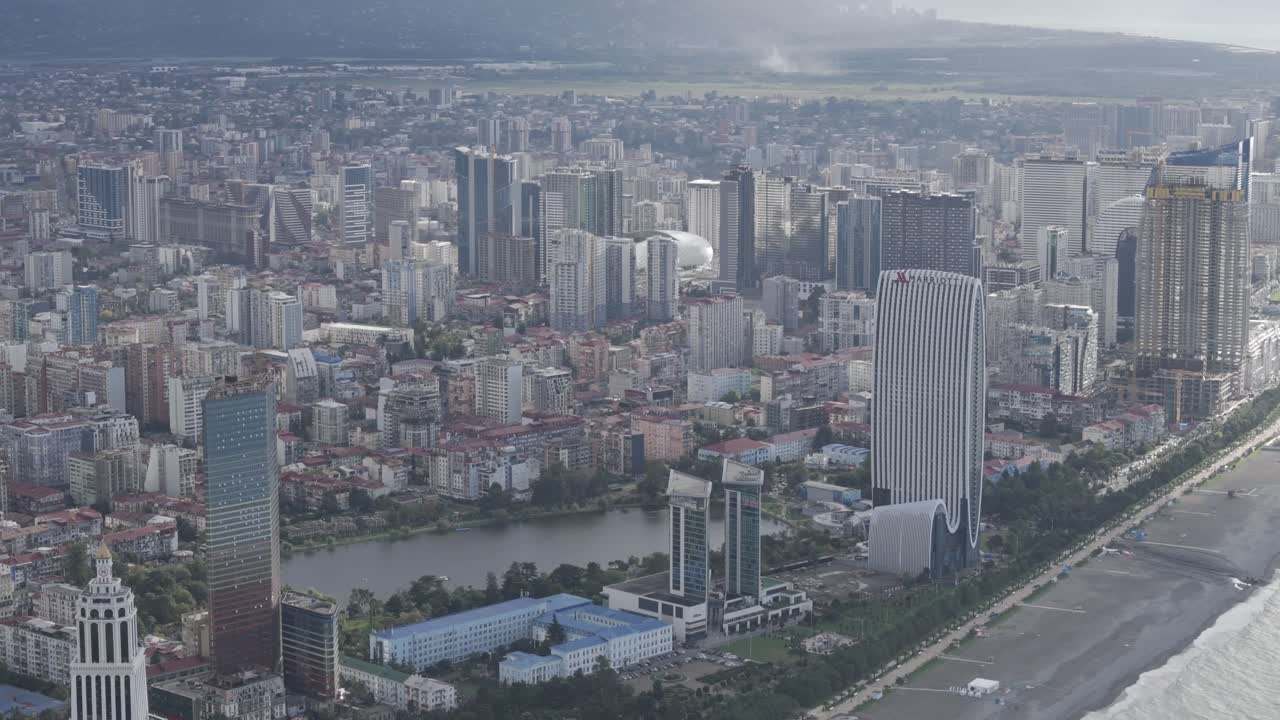 Cinematic daytime drone footage of Batumi skyline and skyscrapers.