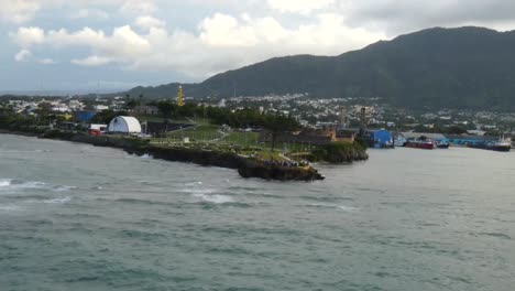 Ship-exiting-Taino-Bay,-view-of-Fort-San-Felipe-as-exiting-Taino-Bay,-Puerto-Plata,-Dominican-Republic