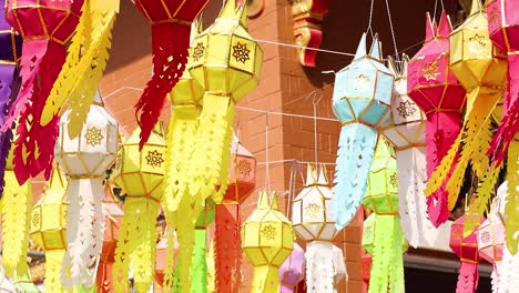 colorful lanterns swaying in the breeze