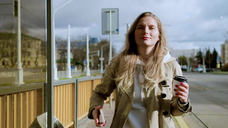 young woman at bus stop