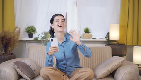 The-young-woman-waving-at-the-camera.