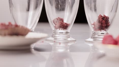 Cook-preparing-delicious-tasty-chocolate-traditional-desert-on-glass-cup-at-local-restaurant-detail-close-up-shot