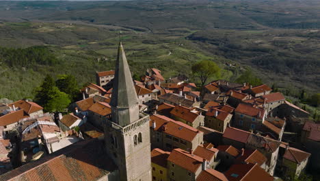 church tower and old building roofs on scenic hilltop town of groznjan in istria, croatia