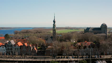 aerial: the historical town of veere with an old harbour and churches, on a spring day