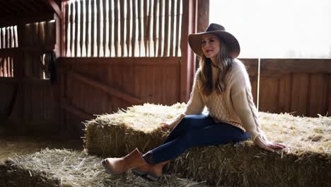 woman relaxing in a barn