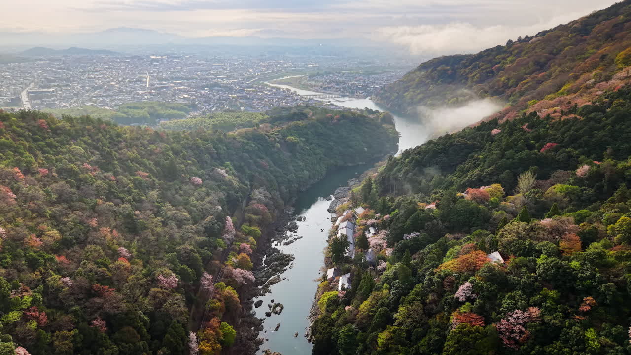 Aerial drone view of the Katsura River in Arashiyama, Japan in daylight