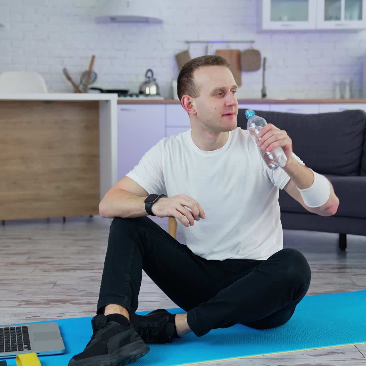 Quarantine isolation indoor training. Sporty handsome man doing exercise at home