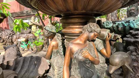 bronze fountain with classical statues