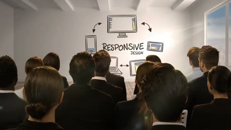 Business-people-looking-at-digital-screen-showing-responsive-design