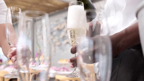 staff pouring champagne at a function