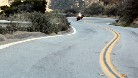 Motorcycle-and-cars-on-winding-mountain-road-3