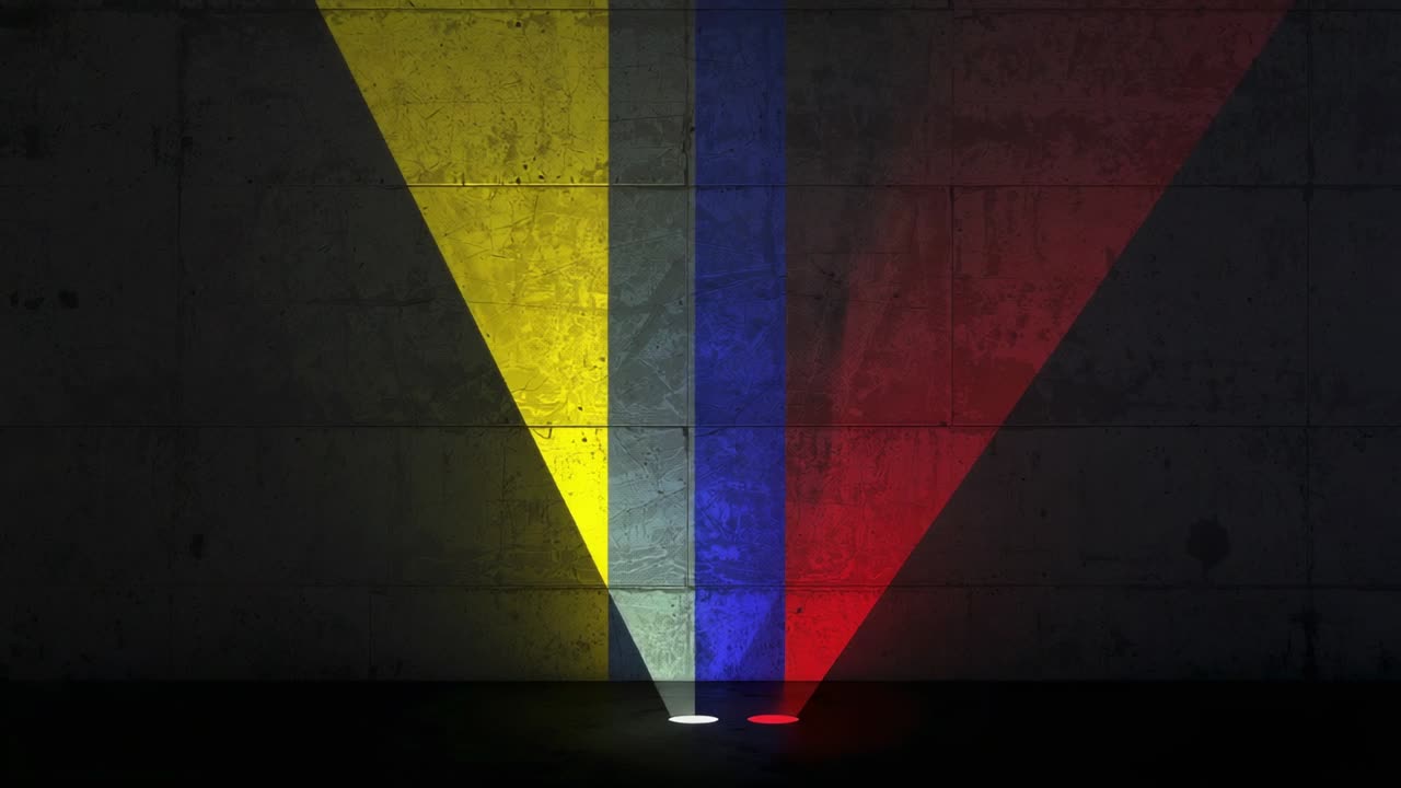 Powering up three floor lights widening red blue yellow beams on concrete wall, revealing texture